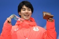 平昌冬季五輪、フリースタイルスキー男子モーグルのメダル授与式で銅メダルを授与された原大智（2018年2月13日撮影）。(c)AFP PHOTO / Kirill KUDRYAVTSEV