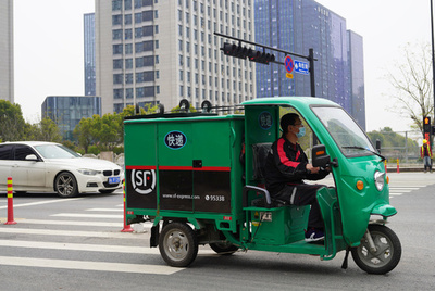 中国宅配業界の価格競争余波 収入が増えない配達員