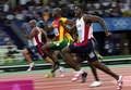 アテネ五輪、陸上男子100メートル決勝に臨むジャスティン・ガトリン（手前、2004年8月22日撮影）。(c)HENRIK MONTGOMERY / SCANPIX SWEDEN / AFP