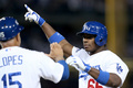 13MLBプレーオフ、ナ・リーグ地区シリーズ（5回戦制）、ロサンゼルス・ドジャース（Los Angeles Dodgers）対アトランタ・ブレーブス（Atlanta Braves）第3戦。適時打を放ち歓喜するロサンゼルス・ドジャースのヤシエル・プイグ（Yasiel Puig、2013年10月6日撮影）。(c)AFP/Getty Images/Stephen Dunn