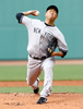 13MLBは20日、各地で試合が行われ、ボストン・レッドソックス（Boston Red Sox）戦で先発登板したニューヨーク・ヤンキース（New York Yankees）の黒田博樹（Hiroki Kuroda）は、7回5安打2失点で9勝目を挙げた。試合はヤンキースが5-2で勝利した。

先発登板するニューヨーク・ヤンキースの黒田博樹（2013年7月20日撮影）。(c)AFP/Getty Images/Jared Wickerham
