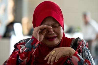 不明機捜索で深まる「混乱」、マレーシアに非難集中