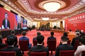 中国の首都北京にある人民大会堂で、映像を通してロシアのウラジーミル・プーチン大統領と話す習近平国家主席（2019年12月2日撮影）。(c)AFP/Noel CELIS