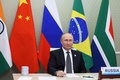 オンライン形式で開かれた新興5か国（BRICS）首脳会議にモスクワから出席するロシアのウラジーミル・プーチン大統領（2022年6月23日撮影）。(c)Mikhail Metzel / SPUTNIK / AFP