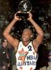Mitch Richmond of the Sacramento Kings hoists his Most Valuable Player trophy 12 February after the 1995 NBA All-Star Game at the America West Arena in Phoenix, Arizona. (c)AFP/VINCE BUCCI