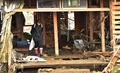 台風19号（アジア名：ハギビス）の影響を受けた長野県で、洪水の被害に見舞われた自宅の部屋に立つ女性（2019年10月15日撮影）。(c)Kazuhiro NOGI / AFP