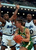 Seattle Supersonic&apos;s forward Detlef Schrempf (#11) has no where to pass as he is defended by Orlando Magic&apos;s forward Dennis Scott (#3) and guard Brian Shaw (#20) at the Orlando Arena, FL, 02 February. (c)AFP/DAVID MILLS