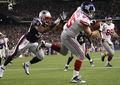 11NFLは6日、各地で第9週の試合が行われ、ニューヨーク・ジャイアンツ（New York Giants）は24-20でニューイングランド・ペイトリオッツ（New England Patriots）に勝利した。

試合終了間際に決勝点となるタッチダウンを決めるジャイアンツのジェイク・バラード（Jake Ballard、2011年11月6日撮影）。(c)AFP/Getty Images/Jim Rogash