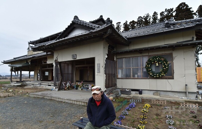 不明の息子を捜し4年、悲しみにとらわれ続ける震災遺族