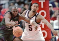 Milwaukee Bucks Vin Baker (L) loses the ball under pressure from Washington Bullets Juwan Howard (R) in the third quarter in Landover, Maryland 17 February. (c)AFP/TED MATHIAS