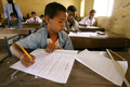 写真は29日、キダルで中学校の入学試験を受ける小学生たち。(c)AFP/KAMBOU SIA