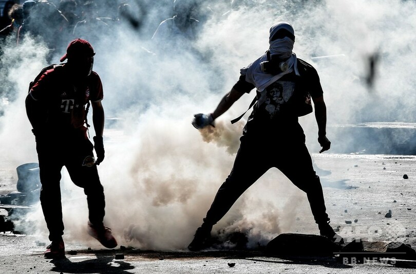 チリ、内閣改造後もデモ隊と治安部隊衝突