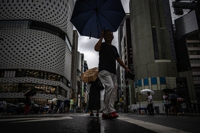 Over 180,000 residents urged to seek shelter as tropical storm soaks Japan