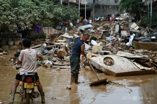 中国南部洪水で39人死亡、復旧作業進む中で新たな台風接近 写真6枚