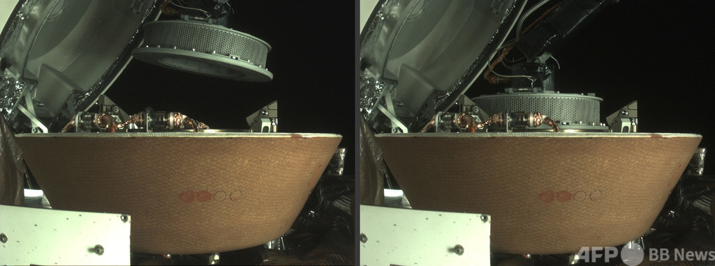 NASA探査機、小惑星ベンヌで採取したサンプル格納に成功 NASA探査機、小惑星ベンヌで採取したサンプル格納に成功