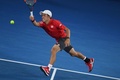 全豪オープンテニス、男子シングルス4回戦。フォアハンドを打つ錦織圭（2017年1月22日撮影）。(c)AFP/WILLIAM WEST