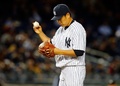 14MLB、ニューヨーク・ヤンキース（New York Yankees）対ボルチモア・オリオールズ（Baltimore Orioles）。2回にボルチモア・オリオールズのジョナサン・スクープ（Jonathan Schoop）に3点本塁打を浴びたニューヨーク・ヤンキースの田中将大（Masahiro Tanaka、2014年4月9日撮影）。(c)AFP/Getty Images/Jim McIsaac