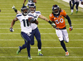 13NFL第48回スーパーボウル（Super Bowl XLVIII）、デンバー・ブロンコス（Denver Broncos）対シアトル・シーホークス（Seattle Seahawks）。第3クオーターに87ヤードのキックオフリターンタッチダウンを決めるシアトル・シーホークスのパーシー・ハービン（Percy Harvin、左、2014年2月2日撮影）。(c)AFP/Getty Images/Tom Pennington