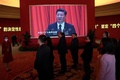 中国・北京の北京展覧館で開催された展示会で、スクリーンに映し出された習近平国家主席（2022年10月12日撮影）。(c)Noel Celis / AFP