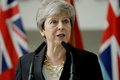 英ロンドン北西部ノースウッドの統合司令部本部で演説するテリーザ・メイ首相（2019年7月8日撮影）。(c)Matt Dunham / POOL / AFP