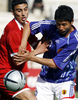 写真は、シリアのDFとボールを競り合う日本の平山相太（%%Sota Hirayama%%、右）。(c)AFP/HO/WORLD SPORT GROUP