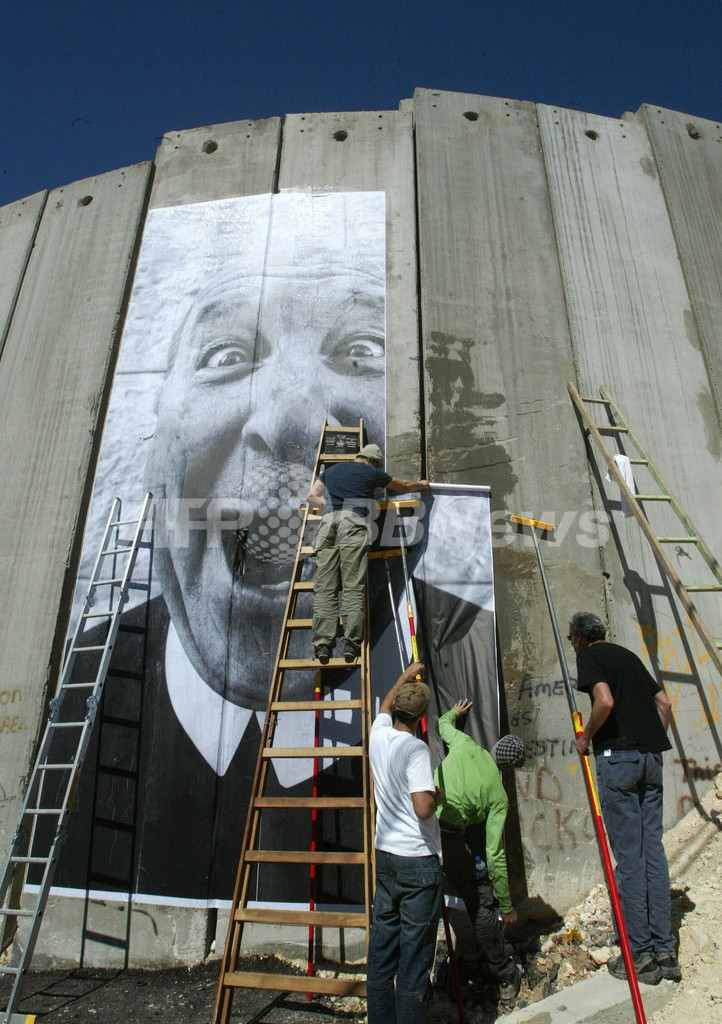 「フェイス・トゥー・フェイス」プロジェクトで分離壁にアート - パレスチナ自治区