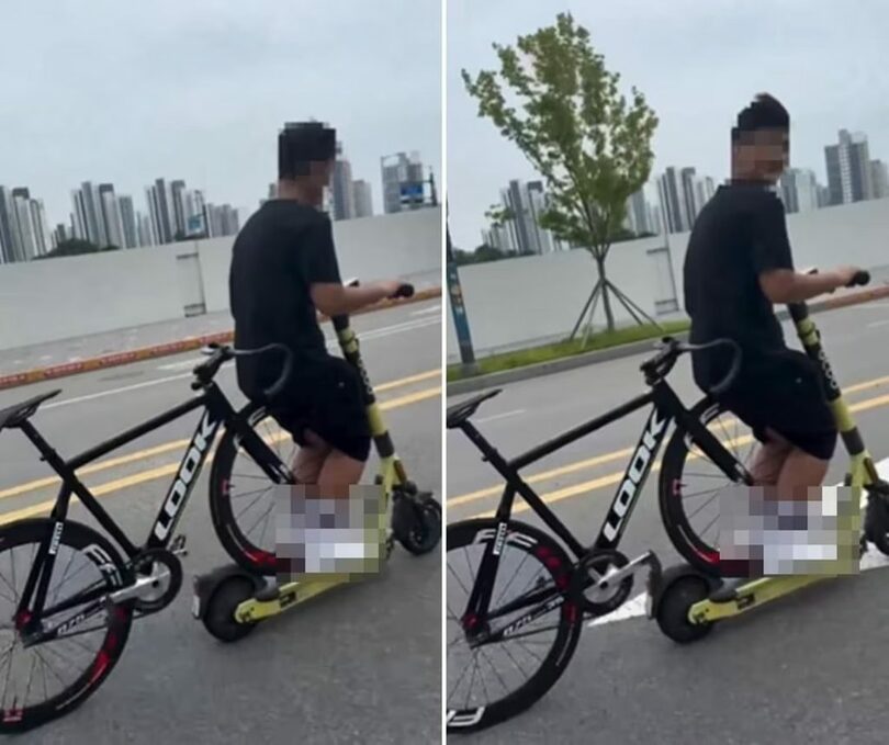 電動キックボードに自転車を載せたまま道路を走る男性のSNS動画 (c)news1
