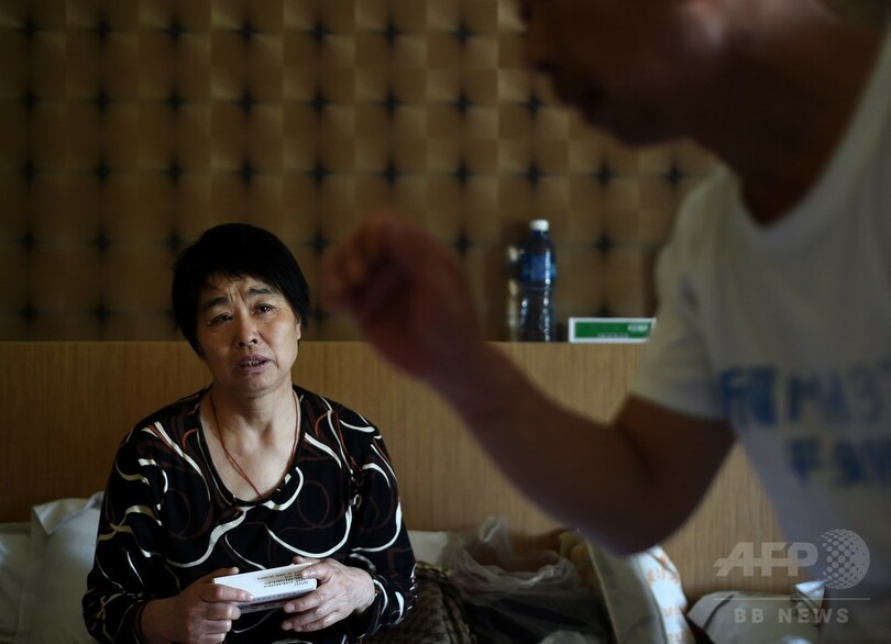 マレーシア機失踪1年、出口のない親族たちの苦悩