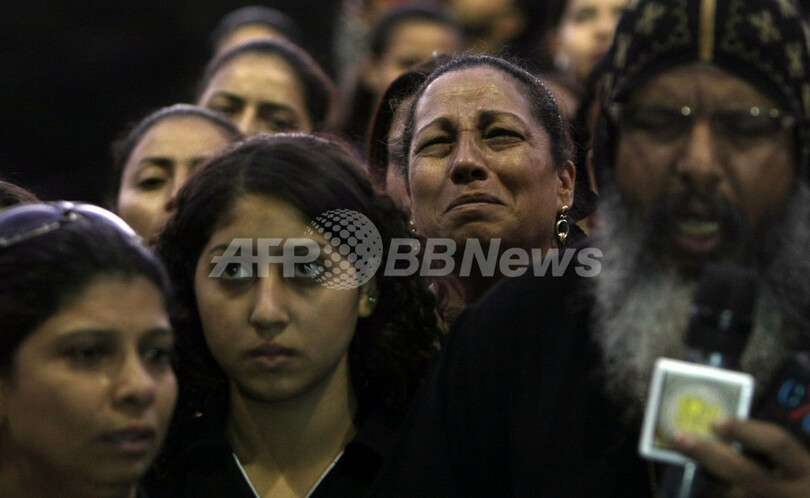 デモの犠牲者悼むコプト教徒たち、エジプト