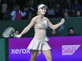 女子テニス、WTAツアー選手権（BNP Paribas WTA Championships - Singapore 2014）2日目。勝利を喜ぶカロリーネ・ボズニアツキ（Caroline Wozniacki、2014年10月21日撮影）。(c)AFP/ROSLAN RAHMAN 
