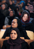 アフガニスタンの首都カブール（Kabul）で行われた「国際女性の日（International Womens Day）」の催しでハミド・カルザイ（Hamid Karzai）大統領の講演を聴く女性たち（2011年3月8日撮影）。(c)AFP/SHAH Marai
