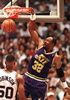Utah Jazz forward Karl Malone (R) dunks to score two points as San Antonio Spurs&apos; David Robinson (L) watches the first quarter action 14 May during game five of the Western Conference Semi final at the Alamodome in San Antonio, Texas. (c)AFP/Paul K. BUCK