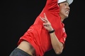 全豪オープンテニス、男子シングルス4回戦。サーブを打つ錦織圭（2017年1月22日撮影）。(c)AFP/SAEED KHAN