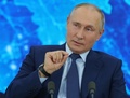 ロシアの首都モスクワ郊外ノボ・オガリョボの公邸でビデオリンクを通じて毎年恒例の記者会見を行うウラジーミル・プーチン大統領（2020年12月17日撮影）。(c)Mikhail Klimentyev / SPUTNIK / AFP