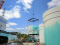 福島第1原子力発電所で、津波によって破壊された重油タンク（2011年6月29日、東京電力撮影）。(c)AFP/TEPCO