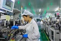 江西省・瑞昌市にある江西瑞晟科技で注文に対応するためにスマート生産ラインで忙しく働く作業員（撮影日不明、資料写真）。(c)People’s Daily/魏東昇