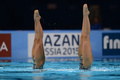 第15回世界水泳選手権（15th FINA World Championships）は21日、スペイン・バルセロナ（Barcelona）でシンクロナイズドスイミングのデュエット・テクニカルルーティン（TR）が行われ、ロシアのスベトラナ・ロマシナ（Svetlana Romashina）／スベトラナ・コレスニチェンコ（Svetlana Kolesnichenko）組が優勝した。

デュエットTR予選の演技に臨む足立夢実（Yumi Adachi）／乾友紀子（Yukiko Inui）組（2013年7月21日撮影）。(c)AFP/JAVIER SORIANO