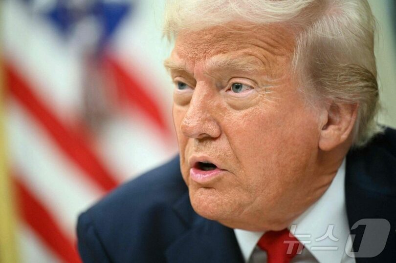 2025年3月31日、ホワイトハウスで行政命令に署名したトランプ米大統領(c)AFP/news1