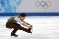 ソチ冬季五輪、フィギュアスケート男子シングル・フリースケーティング（FS）。演技に臨むアブザル・ラクムハリエフ（Abzal Rakimgaliev、2014年2月14日撮影）。(c)AFP/ADRIAN DENNIS