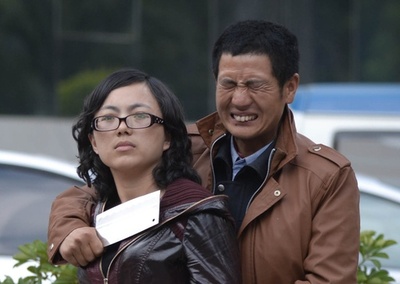 包丁男、路上で女性を人質に 中国