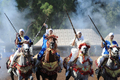 モロッコの首都ラバト（Rabat）で、伝統の騎馬戦術を再現する祭り「ファンタジア（Fantasia）」が開催された。写真は馬に乗る女性の参加者（2009年7月9日撮影）。(c)AFP/FADEL