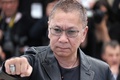 南仏カンヌ（Cannes）で開催中の第66回カンヌ国際映画祭（Cannes Film Festival）で20日、コンペティション部門に出品されている三池崇史（Takashi Miike）監督作『藁の楯』の公式上映が行われ、監督とともに主演の大沢たかお（Takao Osawa）、共演者の松嶋菜々子（Nanako Matsushima）がレッドカーペットを歩いた。この日は、公式上映に先立ち、記者会見とフォトコールも行われた。

写真は、フォトコールに登場した三池監督（2013年5月20日撮影）。(c)AFP/LOIC VENANCE