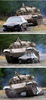 ニュージーランドのクライストチャーチ（Christchurch）にあるアドベンチャー企業「タンクス・フォー・エブリシング（Tanks for Everything）」で、豪軍が使用していた52トンの英国製戦車センチュリオン（Centurion）で乗用車を潰すカナダ・バンクーバー（Vancouver）からの観光客マイケル・ノールさん（左から2人目、2012年2月24日撮影）。(c)AFP/MARTY MELVILLE
