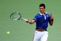 全米オープンテニス、男子シングルス1回戦。リターンを狙うノバク・ジョコビッチ（2015年8月31日撮影）。(c)AFP/Getty Images/Clive Brunskill