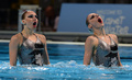 第15回世界水泳選手権（15th FINA World Championships）は21日、スペイン・バルセロナ（Barcelona）でシンクロナイズドスイミングのデュエット・テクニカルルーティン（TR）が行われ、ロシアのスベトラナ・ロマシナ（Svetlana Romashina）／スベトラナ・コレスニチェンコ（Svetlana Kolesnichenko）組が優勝した。

デュエットTR予選の演技に臨むロシアのスベトラナ・ロマシナ／スベトラナ・コレスニチェンコ組（2013年7月21日撮影）。(c)AFP/JAVIER SORIANO
