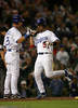 写真は、本塁に生還しチームメイトのルイス・ゴンザレス（%%Luis Gonzalez%%、左）とハイタッチを交わすガルシアパーラ。(c)AFP/Getty Images Stephen Dunn