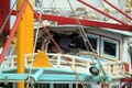 台湾・台南の港に停泊した、台湾海軍のミサイル誤射の直撃を受け損傷した漁船。台湾中央通信社公開（2016年7月1日撮影、公開）。(c)AFP/CNA