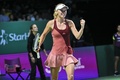 女子テニス、WTAツアー選手権（BNP Paribas WTA Championships - Singapore 2014）4日目。勝利を喜ぶカロリーネ・ボズニアツキ（Caroline Wozniacki、2014年10月23日撮影）。(c)AFP/ROSLAN RAHMAN