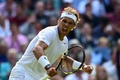 テニス、ウィンブルドン選手権（The Championships Wimbledon 2014）男子シングルス4回戦。第2セットを奪いガッツポーズを見せるラファエル・ナダル（Rafael Nadal、2014年7月1日撮影）。(c)AFP/CARL COURT