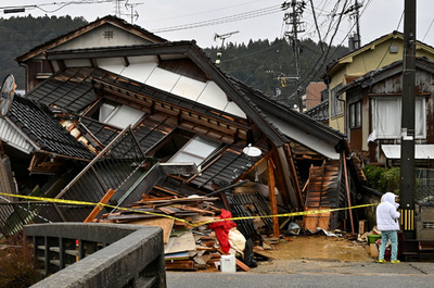 Japan quake toll rises to 73 as weather hampers rescuers